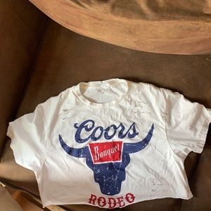 Cropped and distressed Coors rodeo shirt